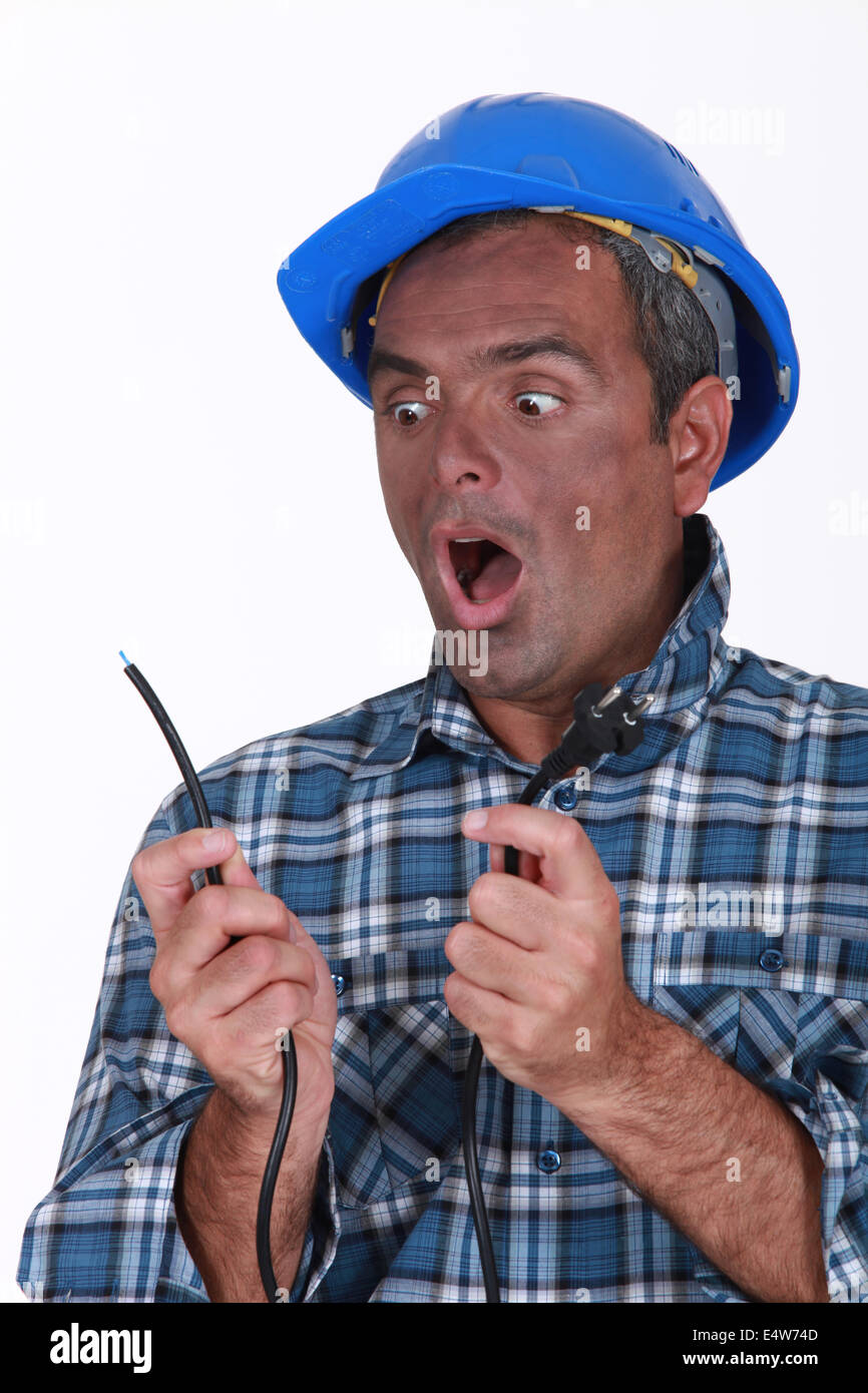 Shocked electrician Stock Photo