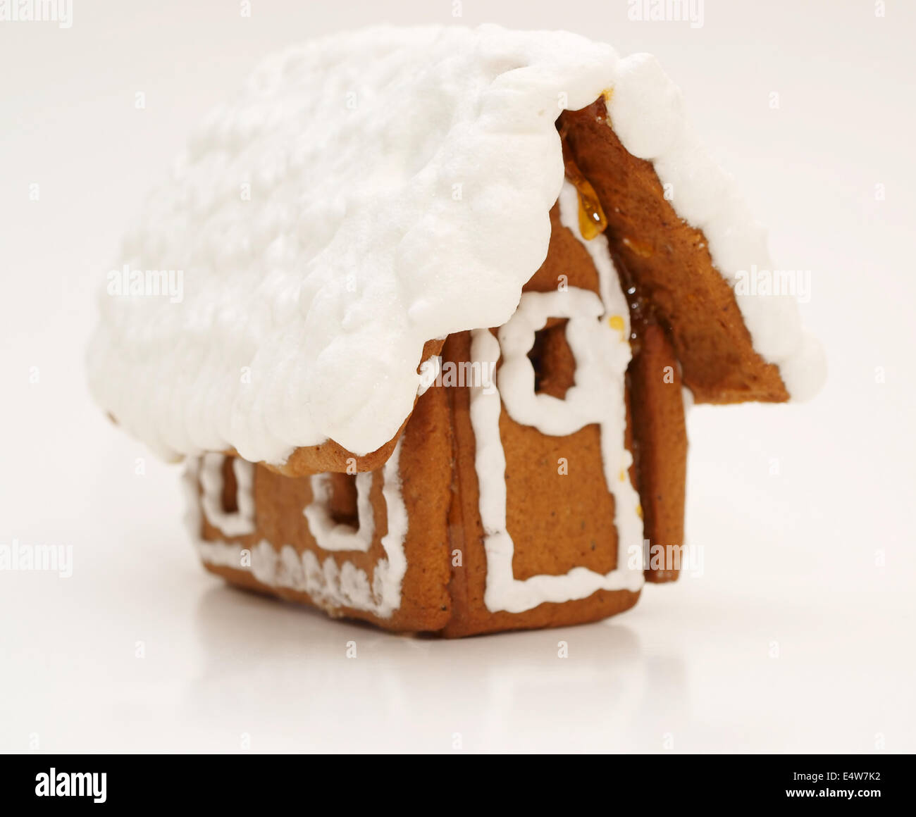 A high-resolution image of a gingerbread house with heavy icing