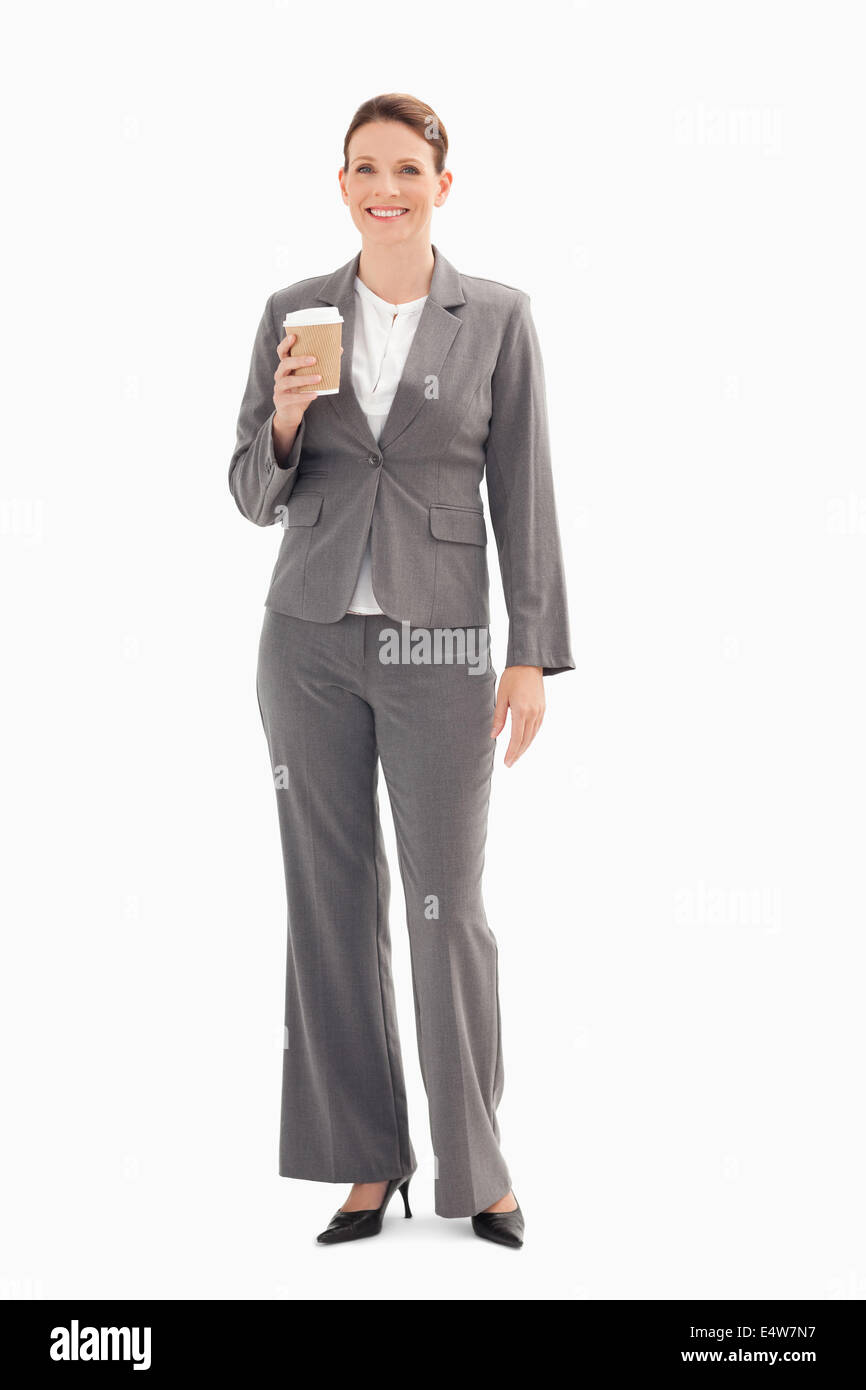 Smiling businesswoman holding cup of coffee Stock Photo - Alamy