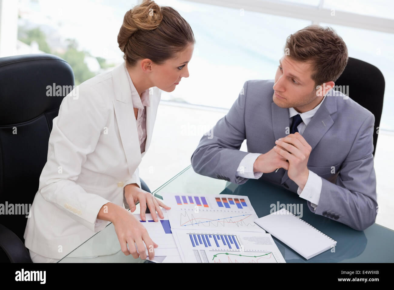 Business team deliberating on market research Stock Photo