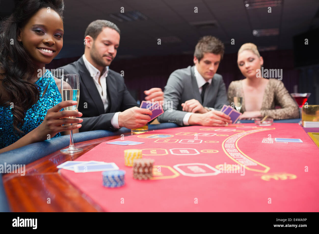 People sitting around the poker table Stock Photo