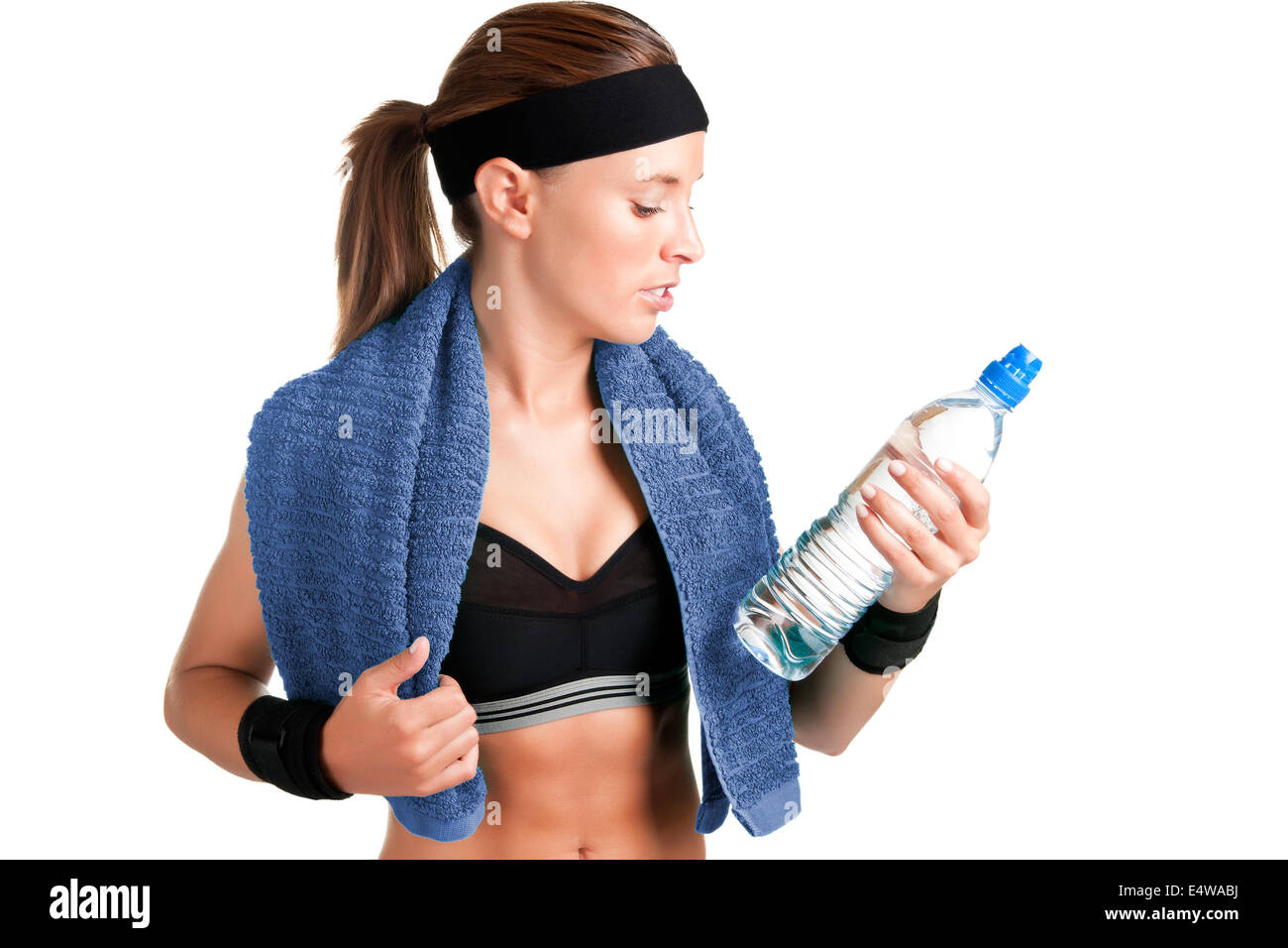 Woman Looking at a Bottle of Water Stock Photo