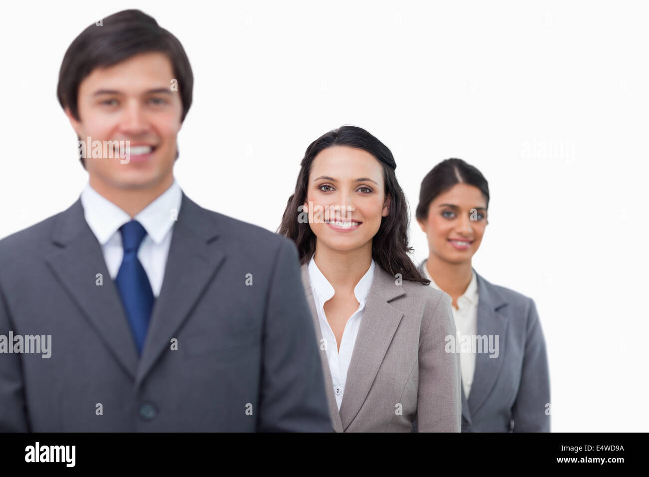 Smiling businesspeople standing in line Stock Photo - Alamy