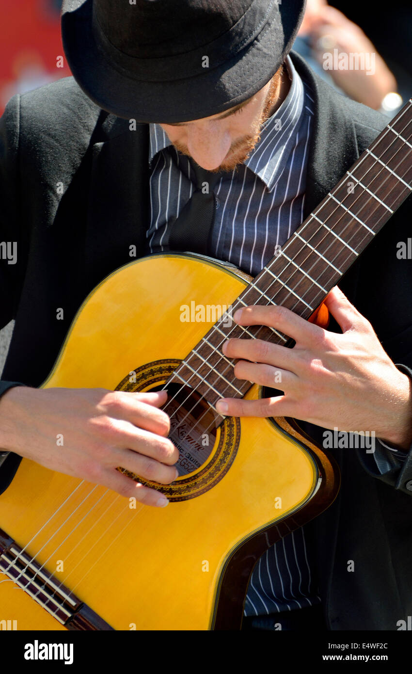 London, England, UK. Guitarist busking in Trafalgar Square Stock Photo