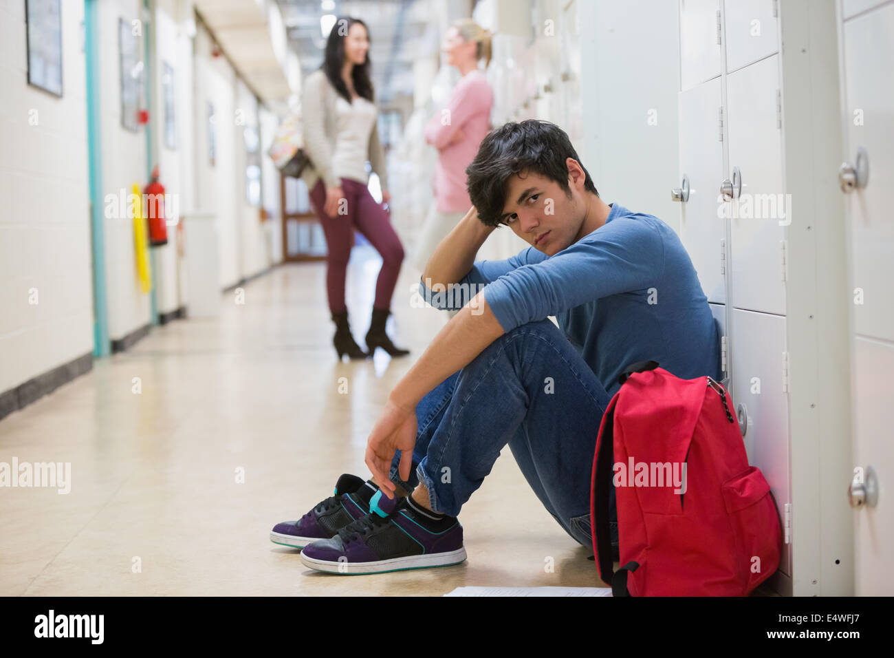 Man sitting on the floor Stock Photo - Alamy