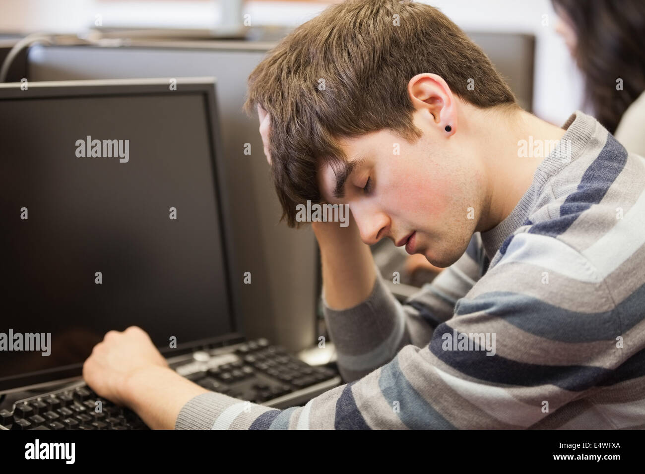 Student sleeping at the computer Stock Photo