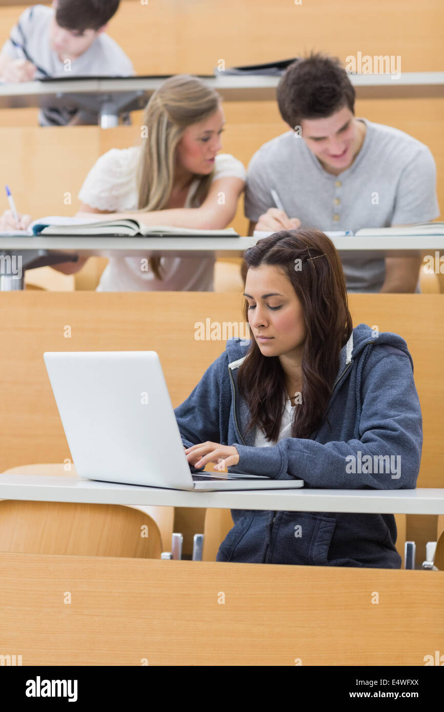 Student using laptop in lecture Stock Photo - Alamy