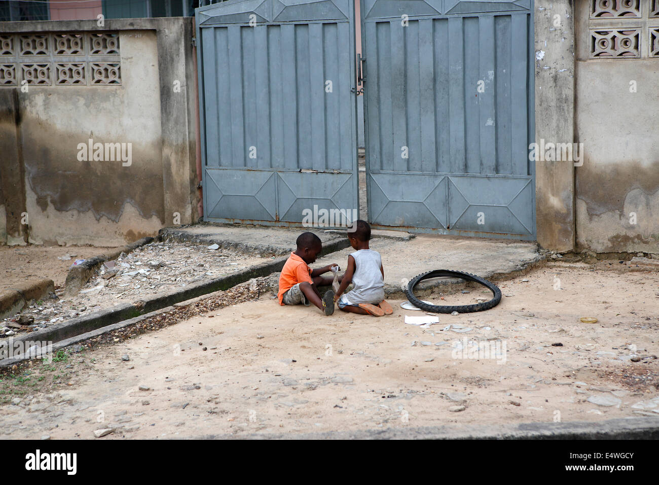 African kids sit outside and play Stock Photo