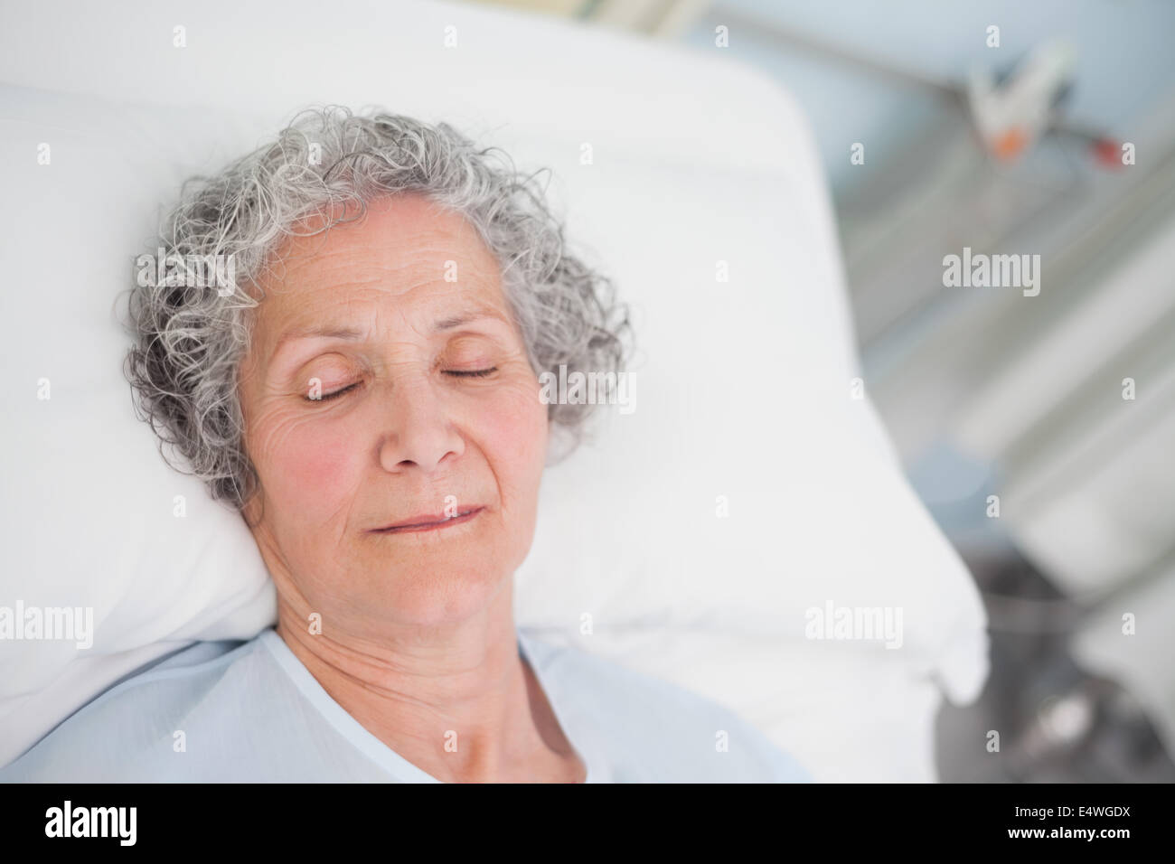 Elderly patient sleeping on a bed Stock Photo Alamy