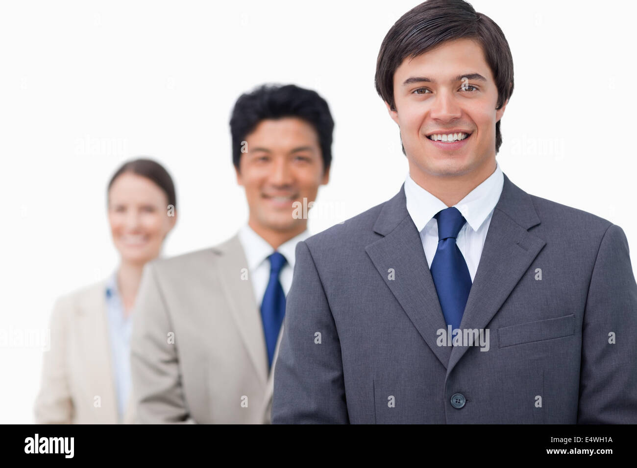 Smiling businesspeople standing in a line Stock Photo - Alamy