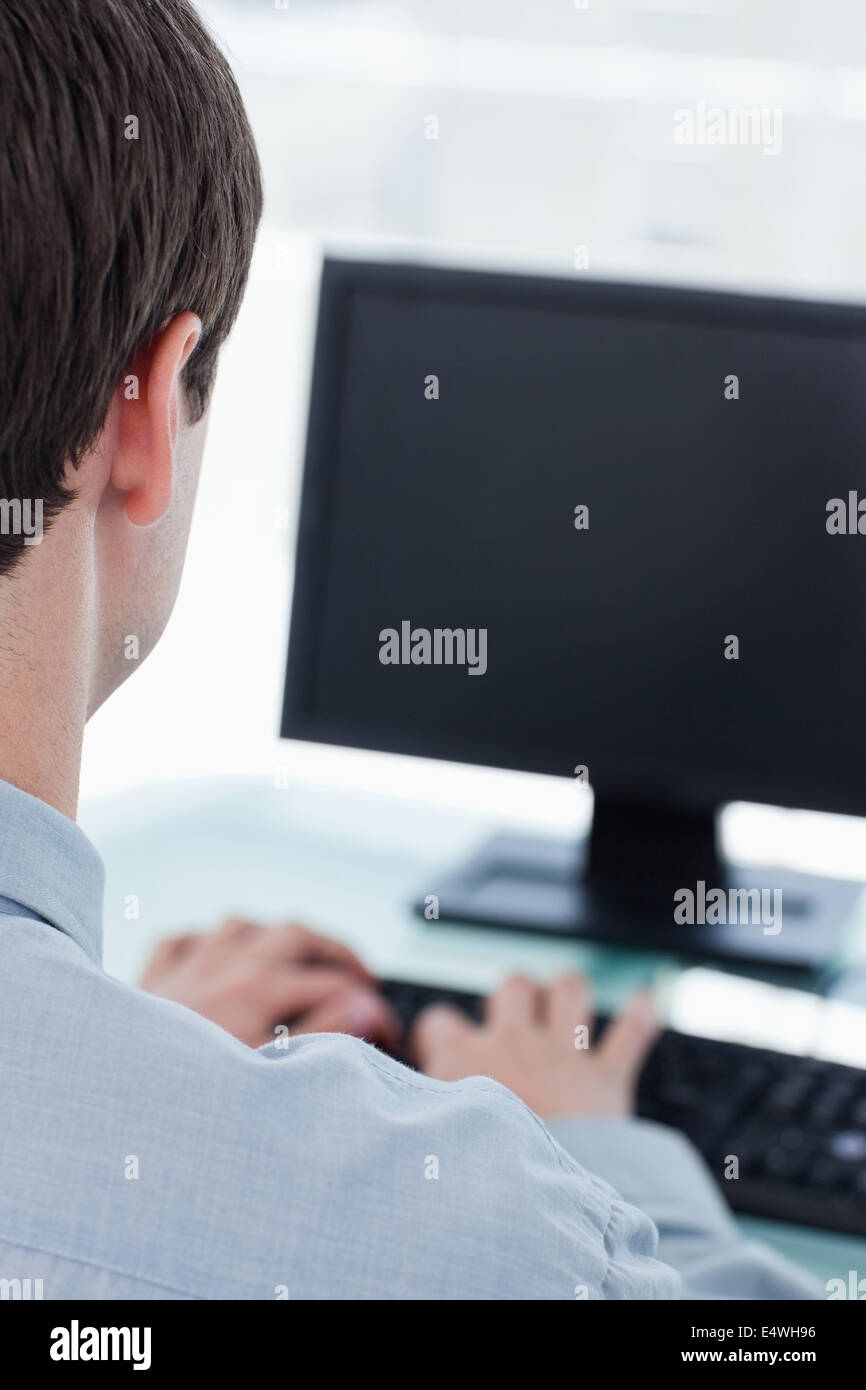 Back view of a businessman using a computer Stock Photo - Alamy