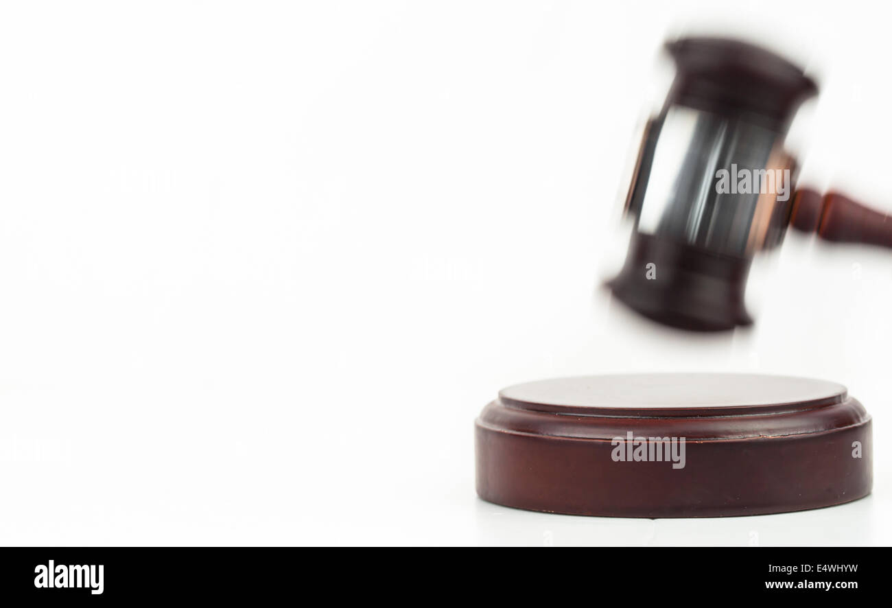 Moving gavel banging on a sound block Stock Photo Alamy