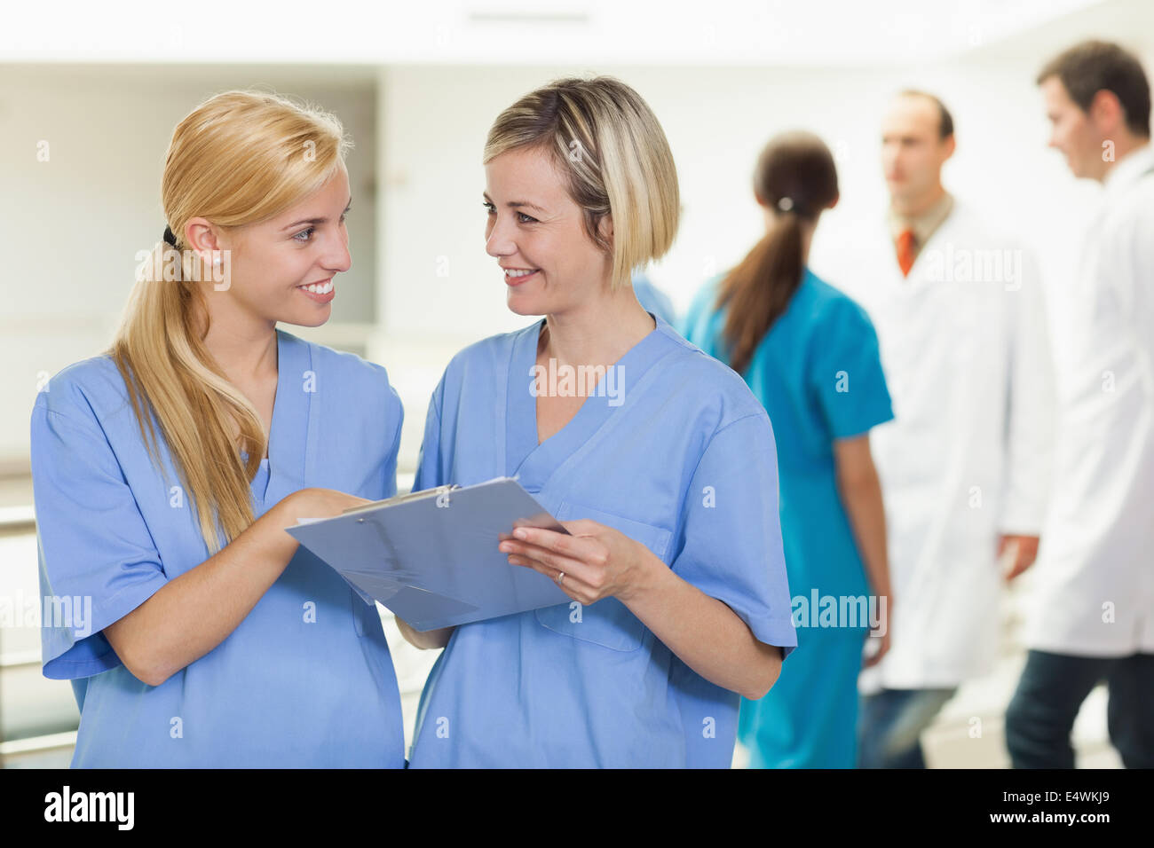 Smiling nurses holding a clipboard Stock Photo - Alamy