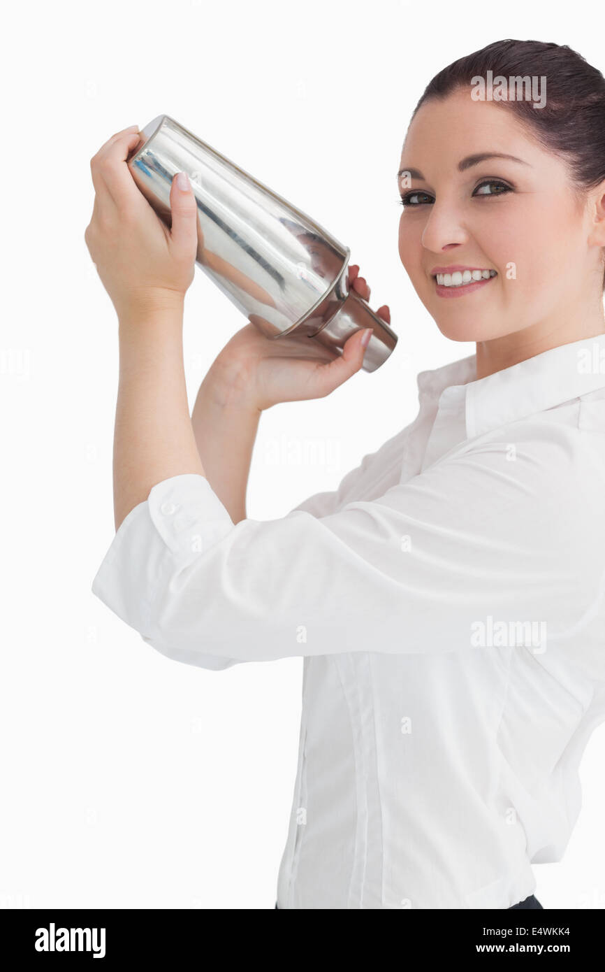 Woman using cocktail shaker Stock Photo Alamy