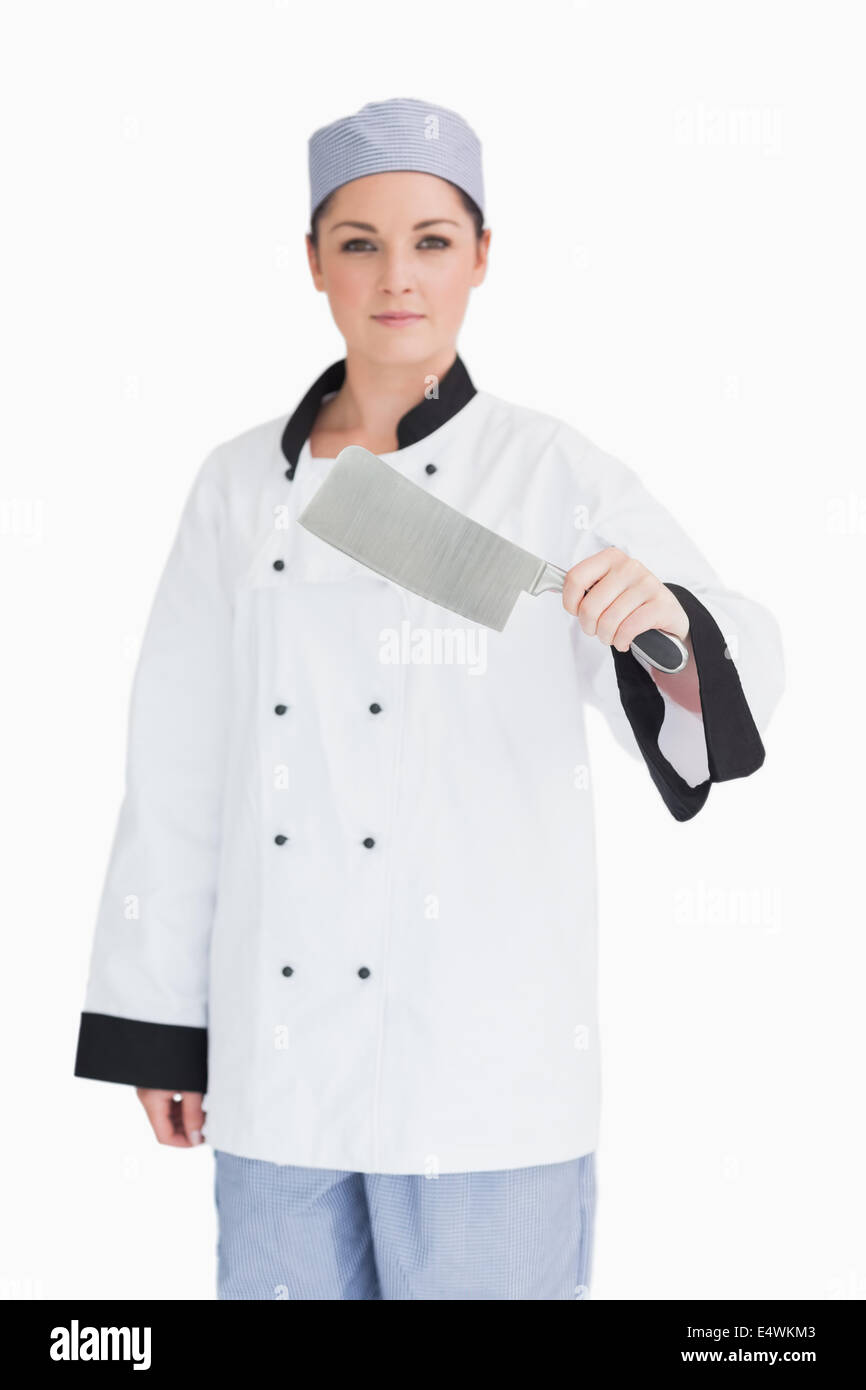 Serious cook holding a meat cleaver Stock Photo