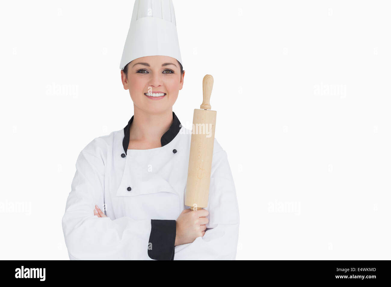 Happy cook holding a rolling pin Stock Photo - Alamy