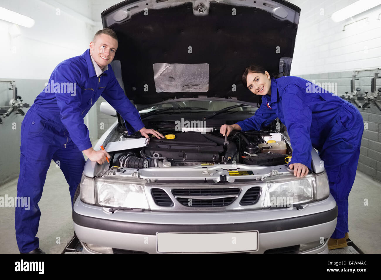Mechanic leaning on machine hi-res stock photography and images - Alamy