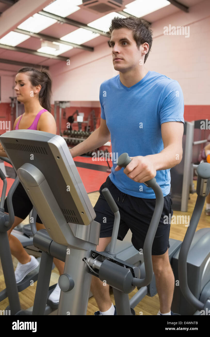 Man on step machine Stock Photo - Alamy