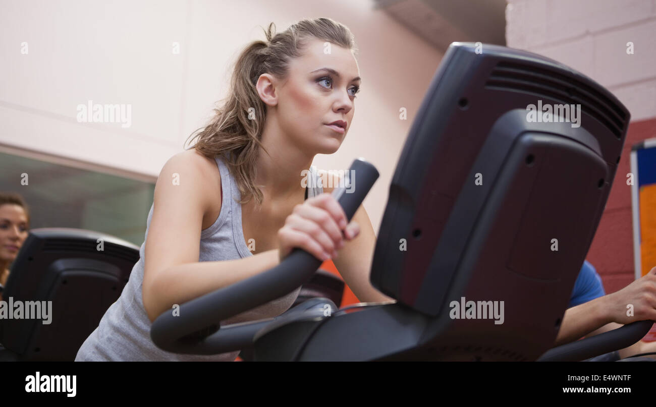 Woman riding in a spinning class Stock Photo