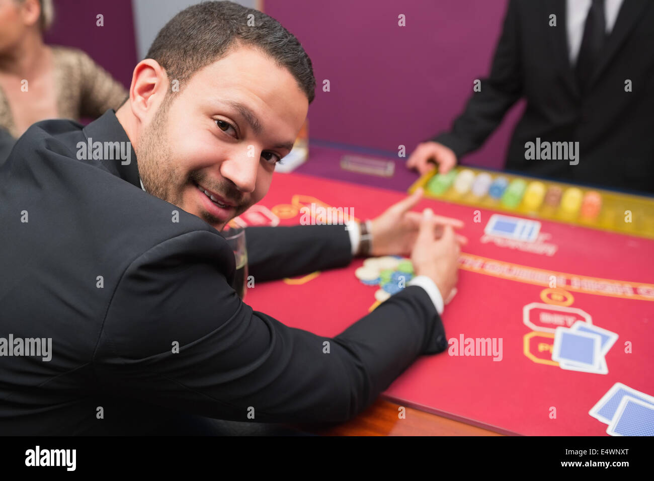 Man looking up from claiming his winnings Stock Photo