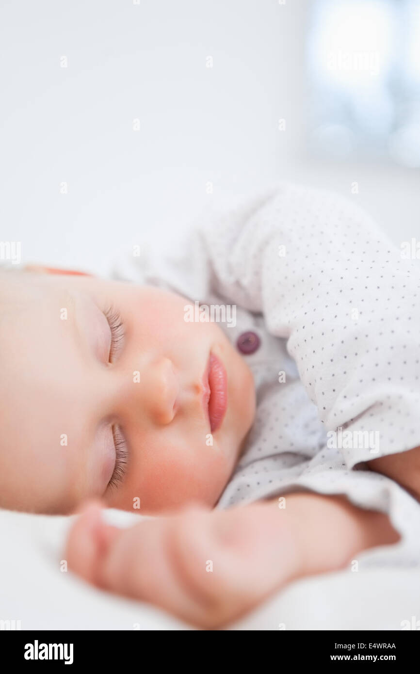 Baby sleeping while extending her arm Stock Photo Alamy