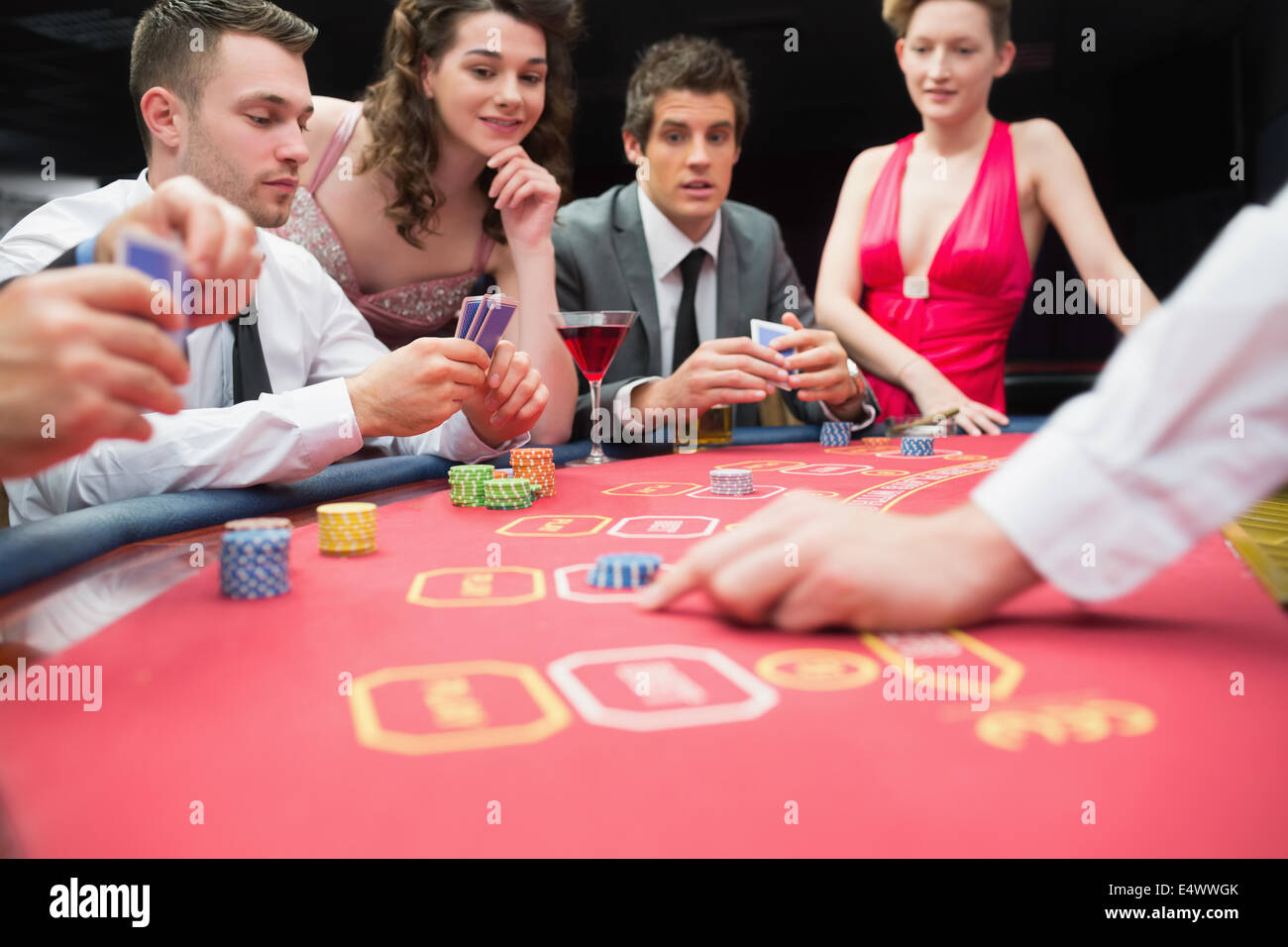 People playing exciting game of poker Stock Photo