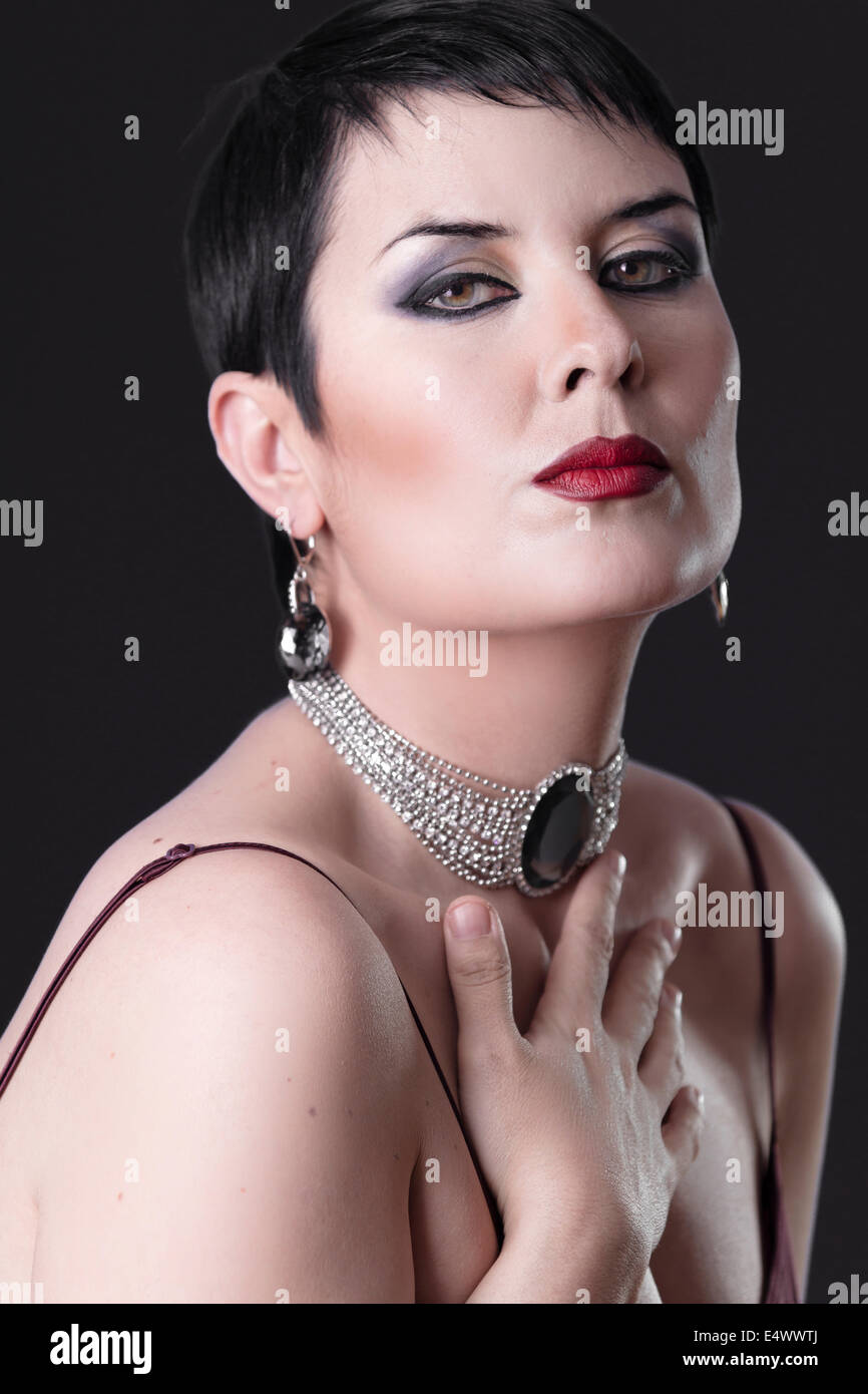 Sexy woman with elegant silver jewelry caressing her breast Stock Photo -  Alamy