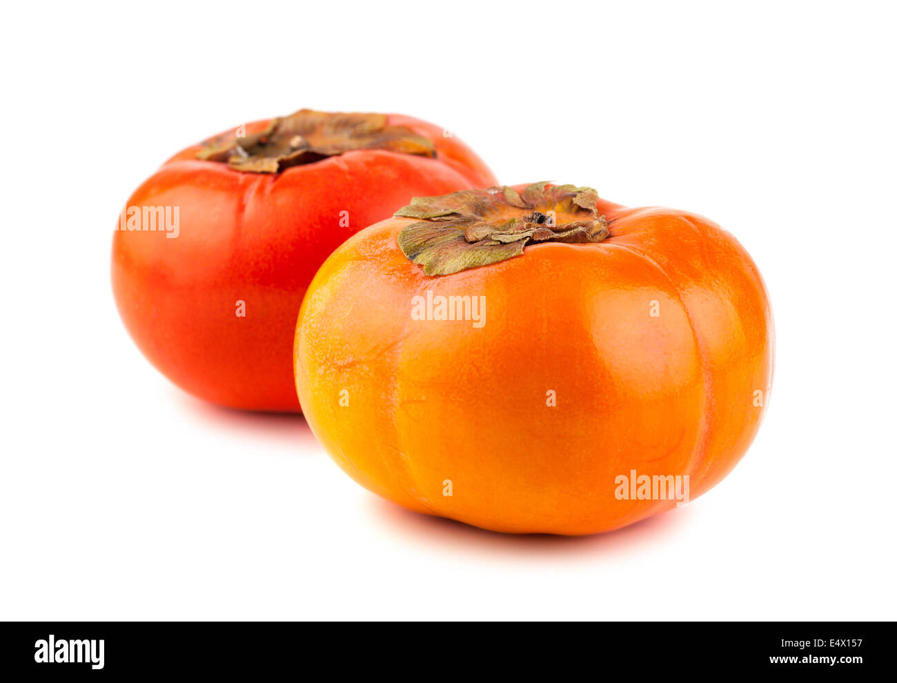 Two ripe persimmon fruits Stock Photo