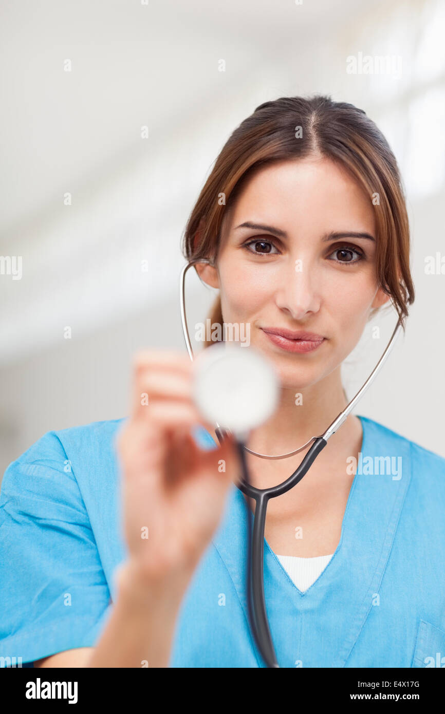 Nurse using a stethoscope Stock Photo - Alamy