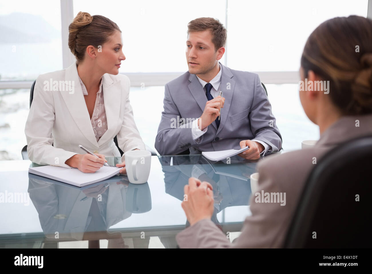 Business team deliberating with lawyer Stock Photo