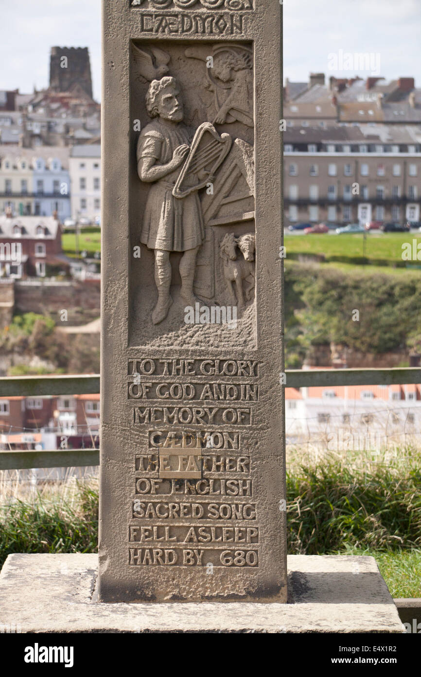 Detail of the Cross of Caedmon in the churchyard of St. Hilda's church near Whitby Abbey, showing Caedmon himself. Stock Photo