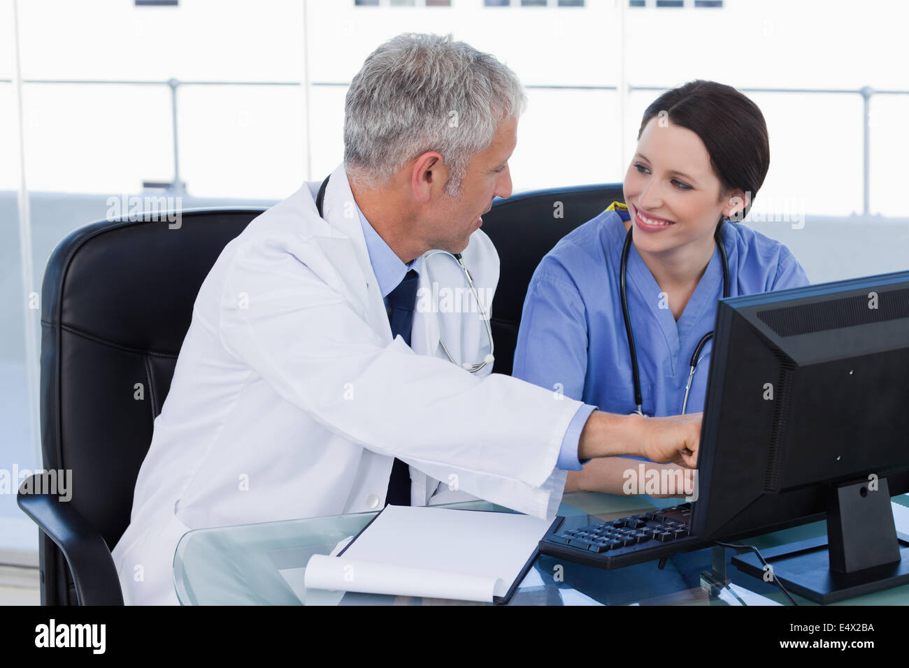 Smiling medical team working hi-res stock photography and images - Alamy