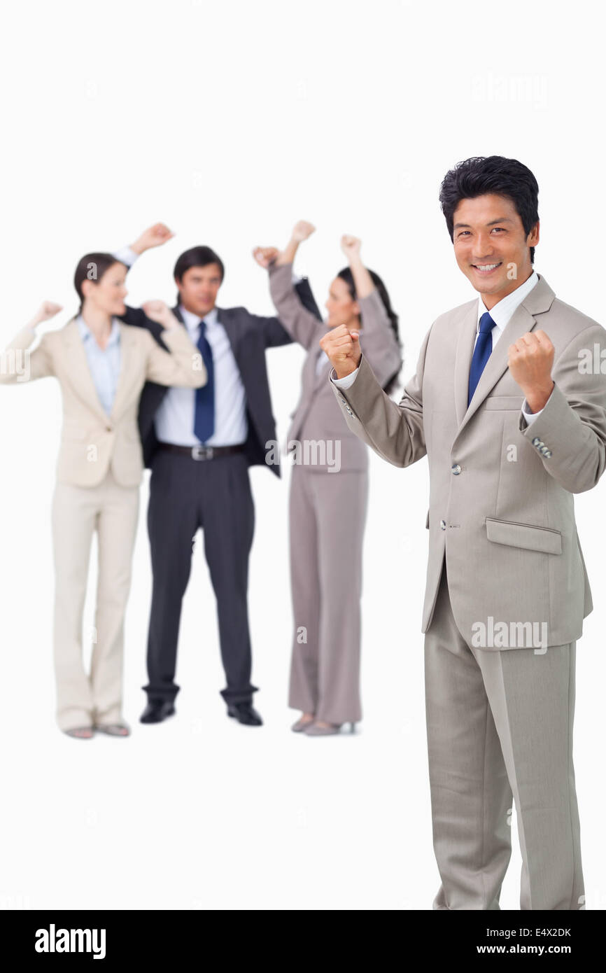 Successful businessman with cheering team Stock Photo - Alamy