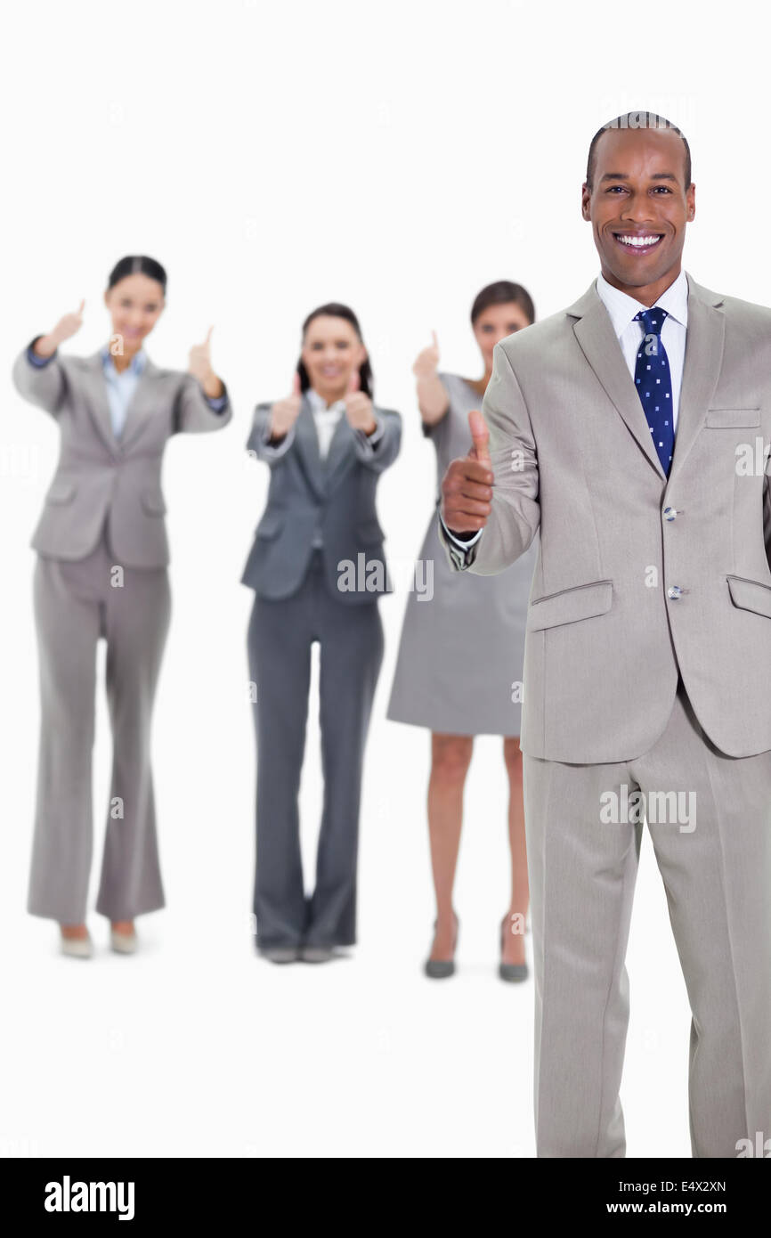 Business team smiling with thumbs up Stock Photo - Alamy
