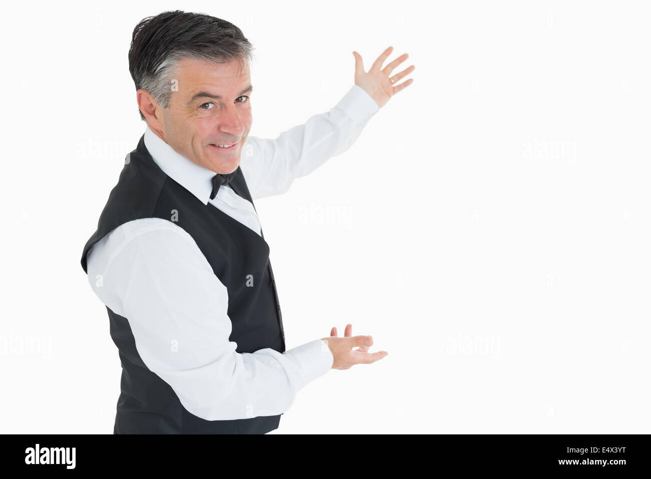 Well-dressed man showing us something Stock Photo