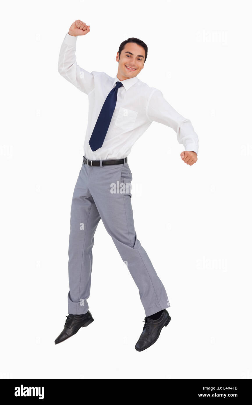 Businessman raising his arms and jumping Stock Photo - Alamy