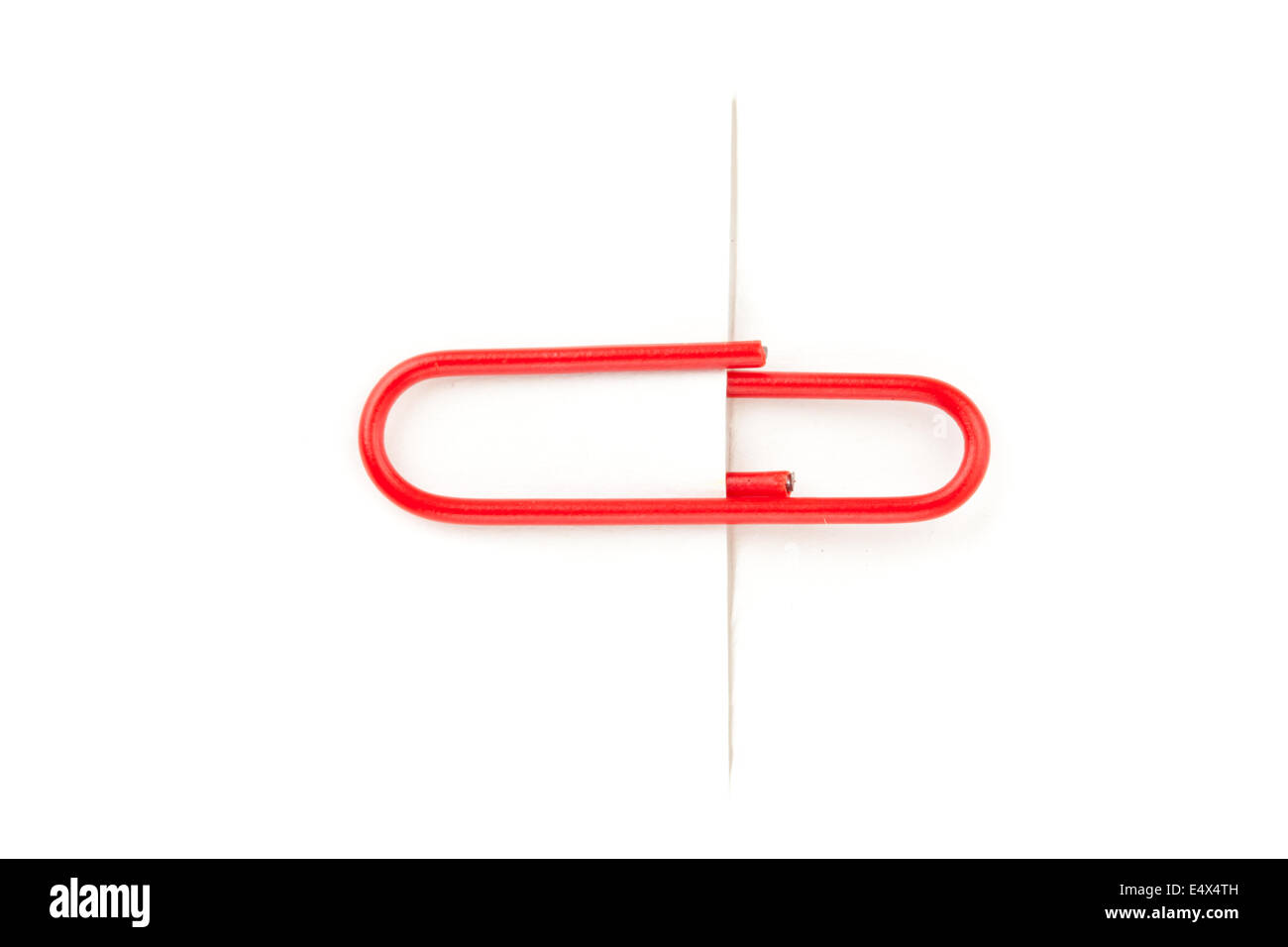 Red paperclip paperclip attaching on paper Stock Photo