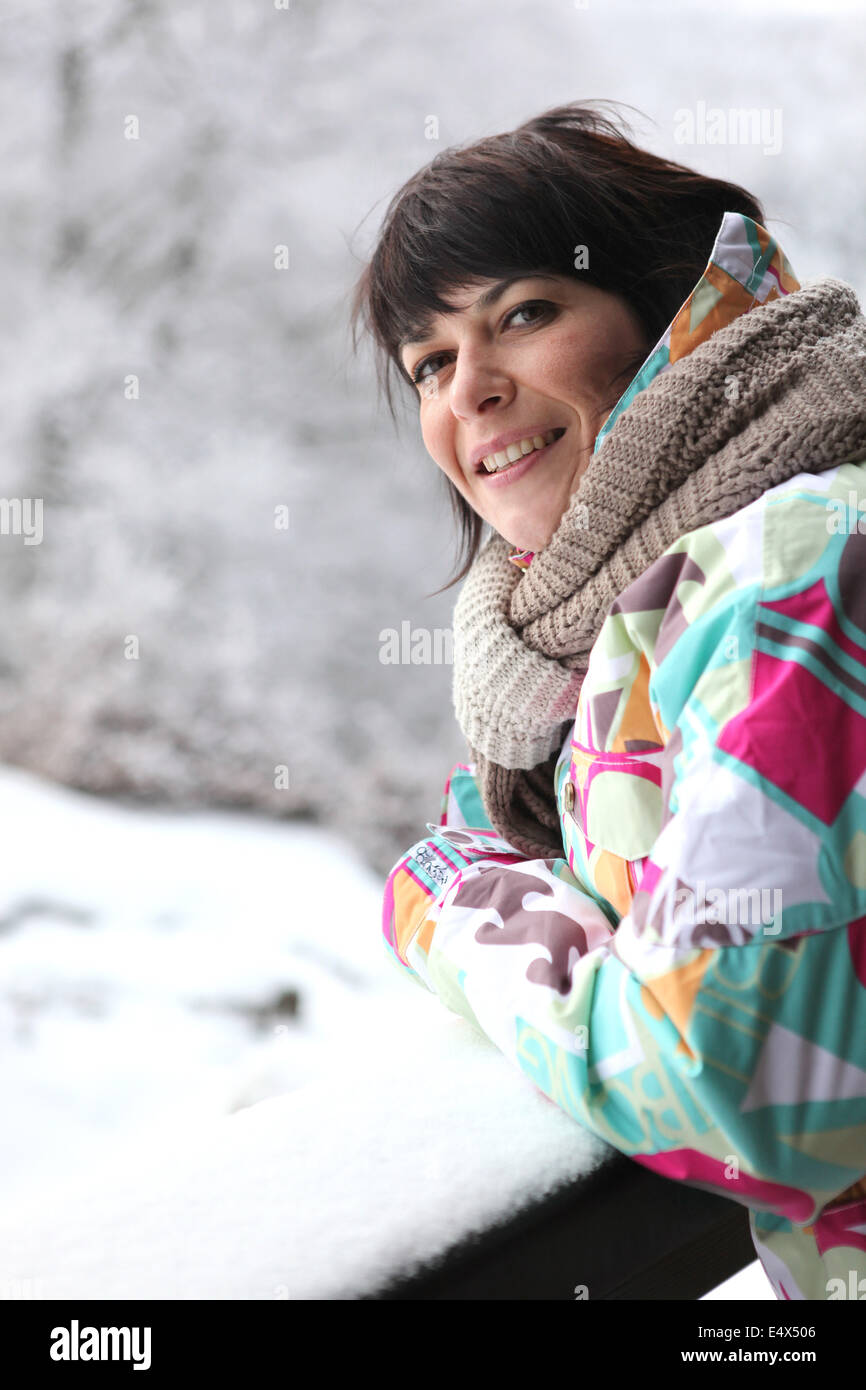 Woman wrapped up in the snow Stock Photo