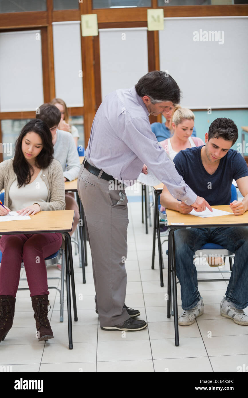 Lecturer helping student Stock Photo