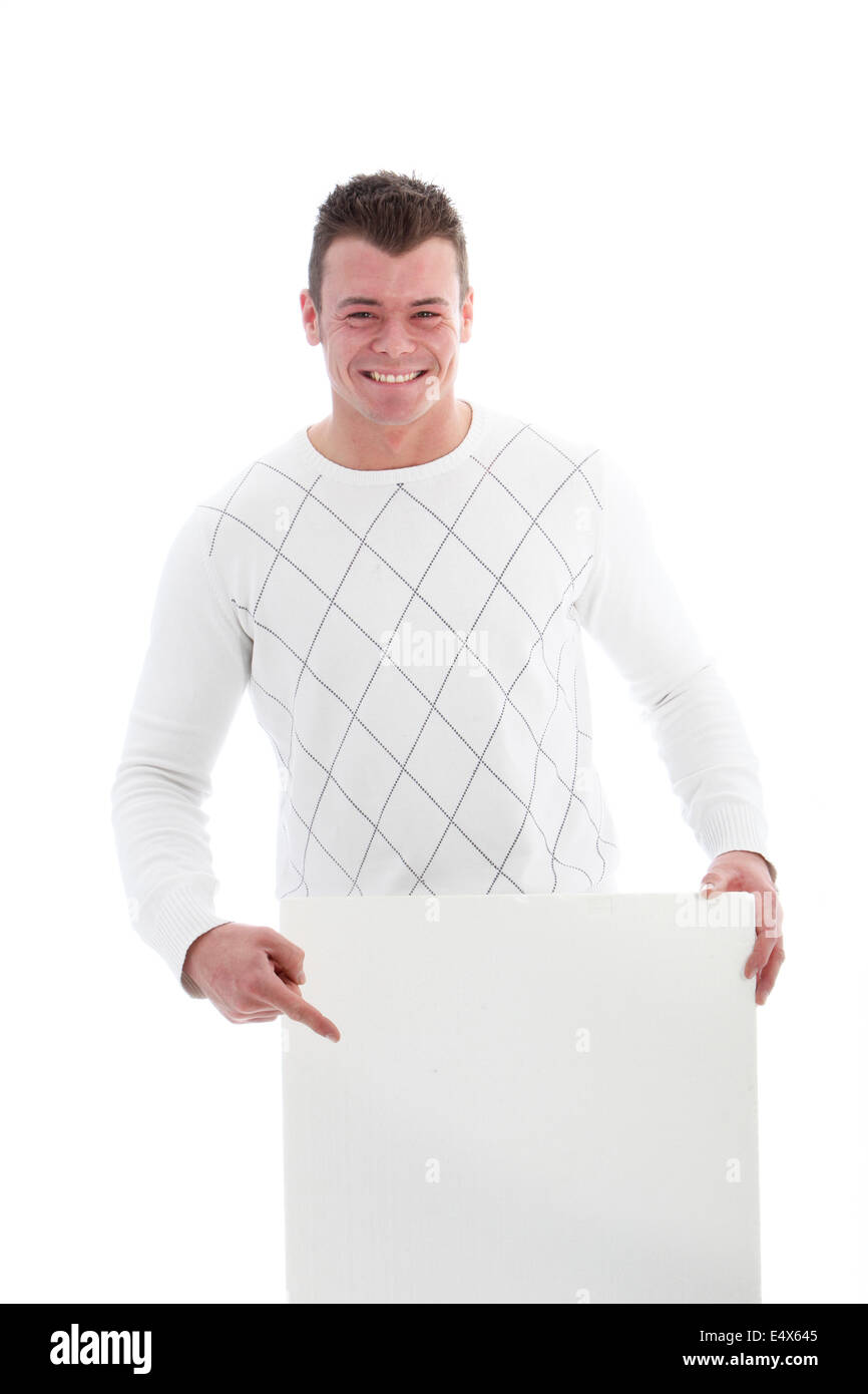 Beaming man pointing to a blank sign Stock Photo