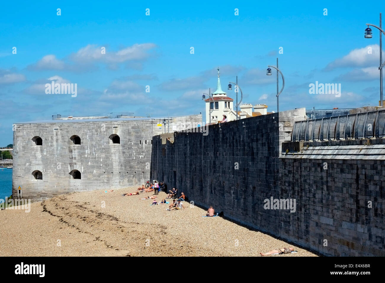 sunbathers on the beach at the hot walls on a hot sunny day between old portsmouth and southsea uk Stock Photo