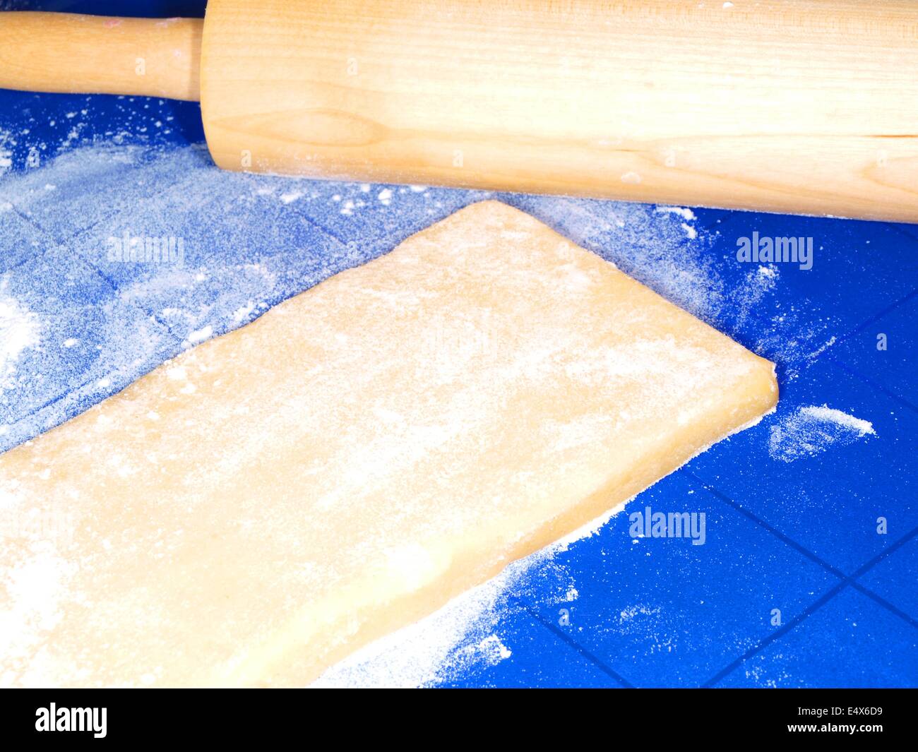 Dough on blue silicon mat Stock Photo