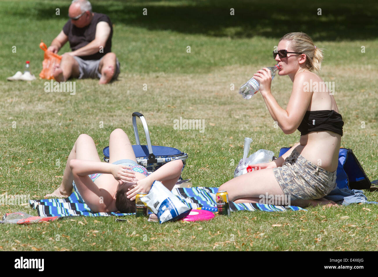 London UK. 17th July 2014. women sunbathing  in Regent's Park  despite a heatwave warning being issued on the hottest day so far as temperatures are forecast to rise to 30 degrees celcius Credit:  amer ghazzal/Alamy Live News Stock Photo