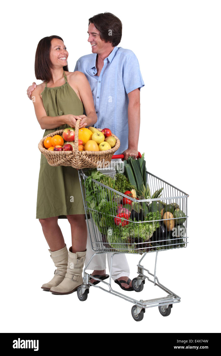 Couple buying fruit and vegetables Stock Photo