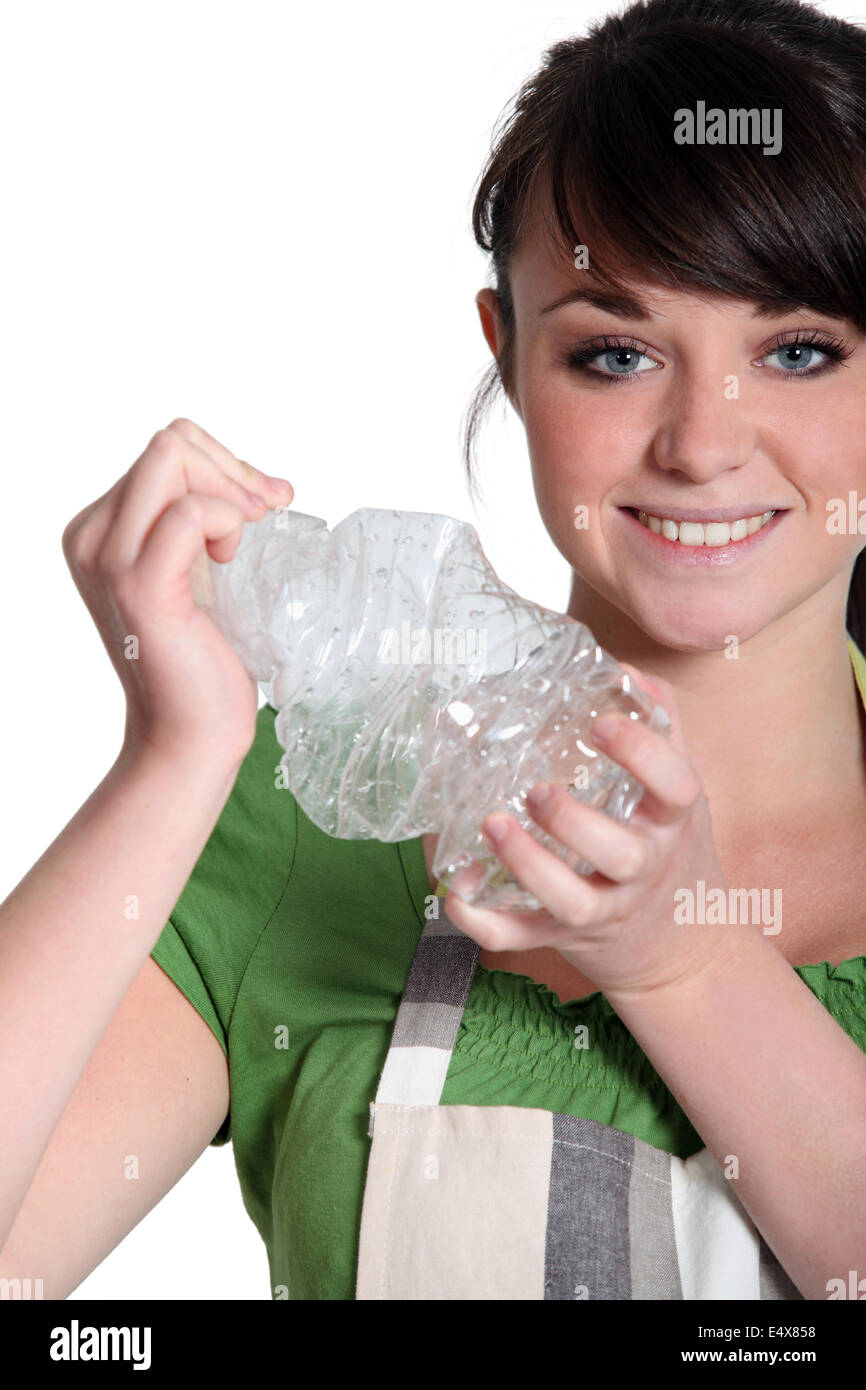 Woman crushing a plastic bottle Stock Photo Alamy