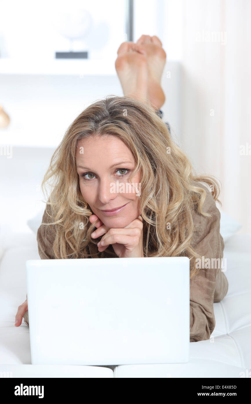 blonde woman working from home Stock Photo