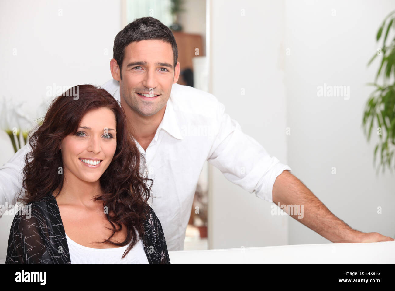 Classy couple in their living room Stock Photo