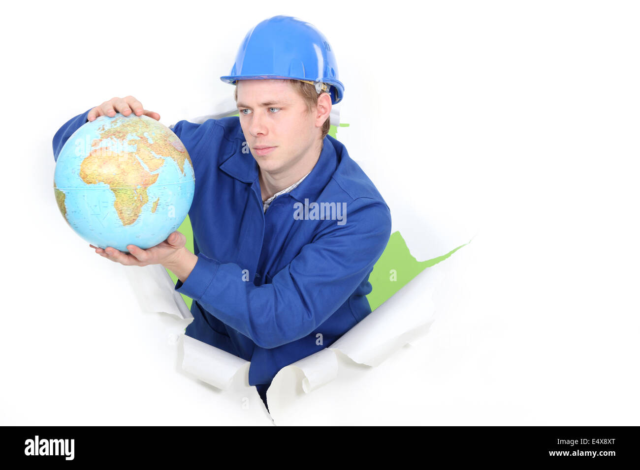 Tradesman holding a globe Stock Photo