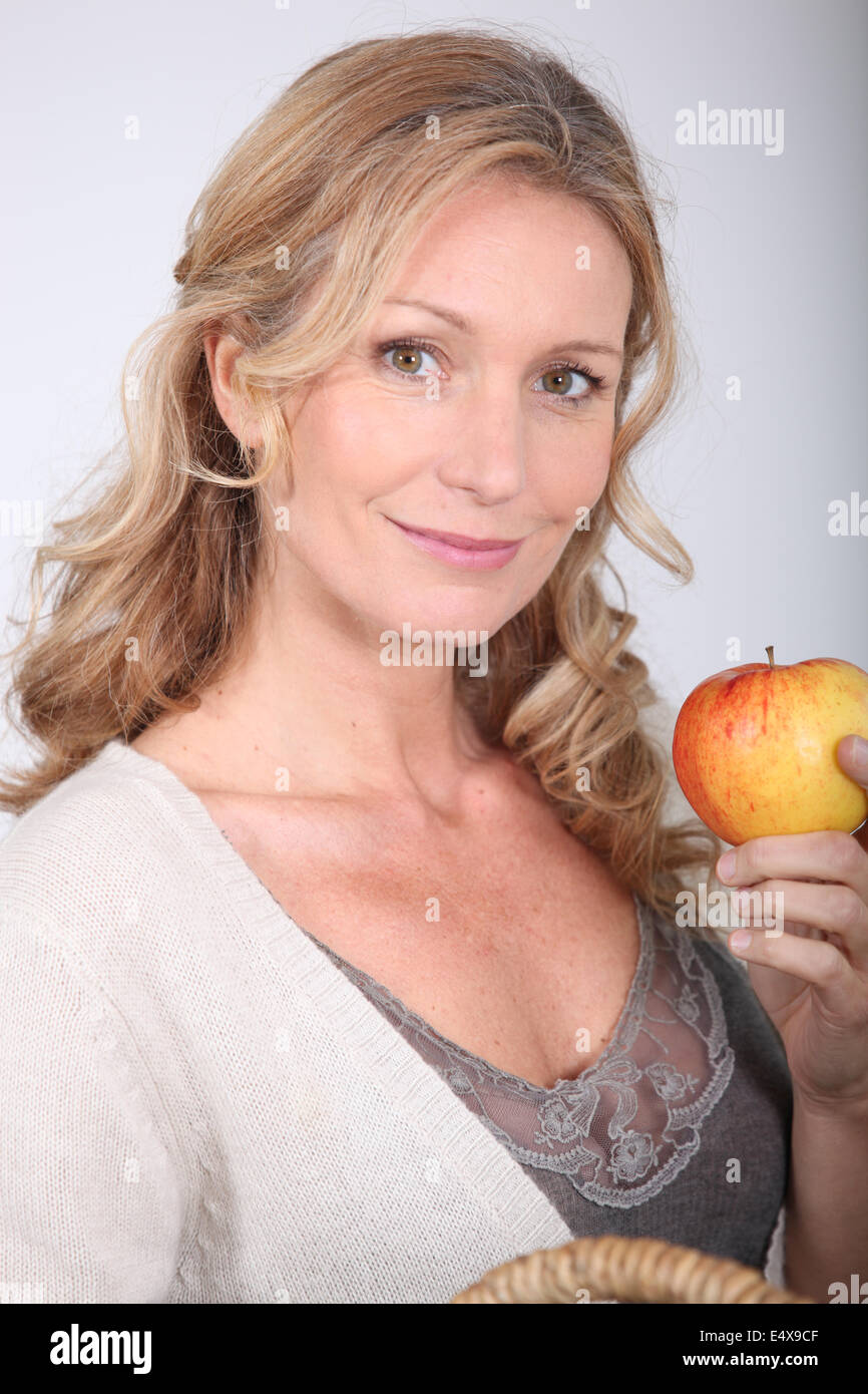 Wife holding apple Stock Photo Alamy