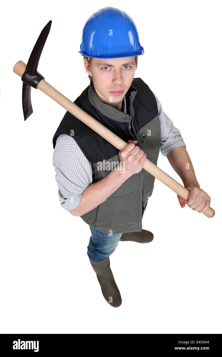 Tradesman holding a pickaxe Stock Photo